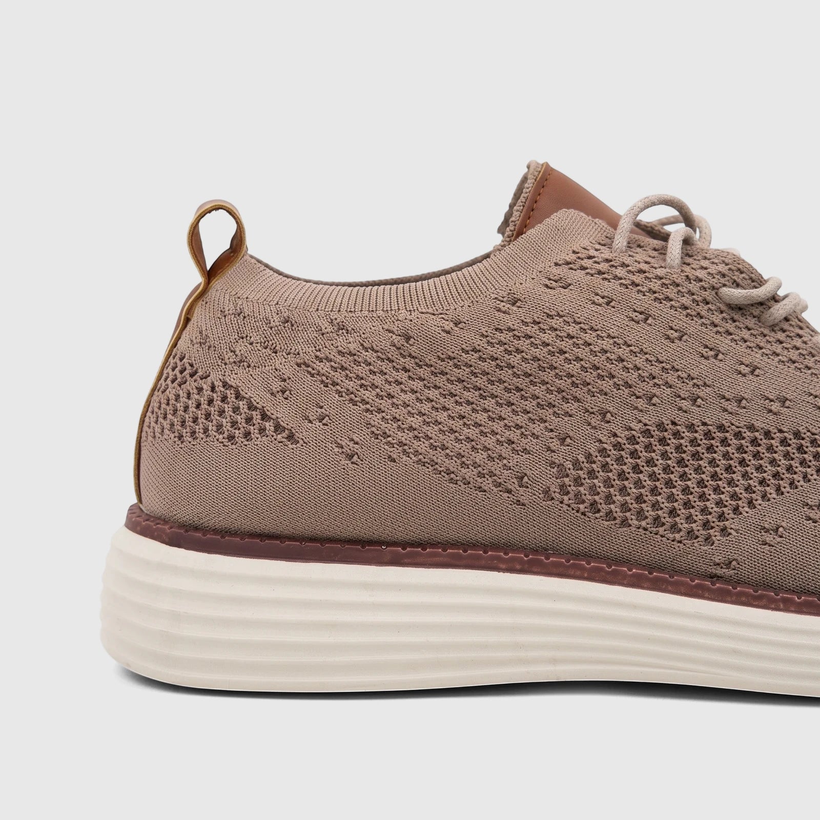 Close-up side view of an HP Men's Comfort Sneaker HPM01029 in beige Flyknit, showcasing the knit upper and textured sole.