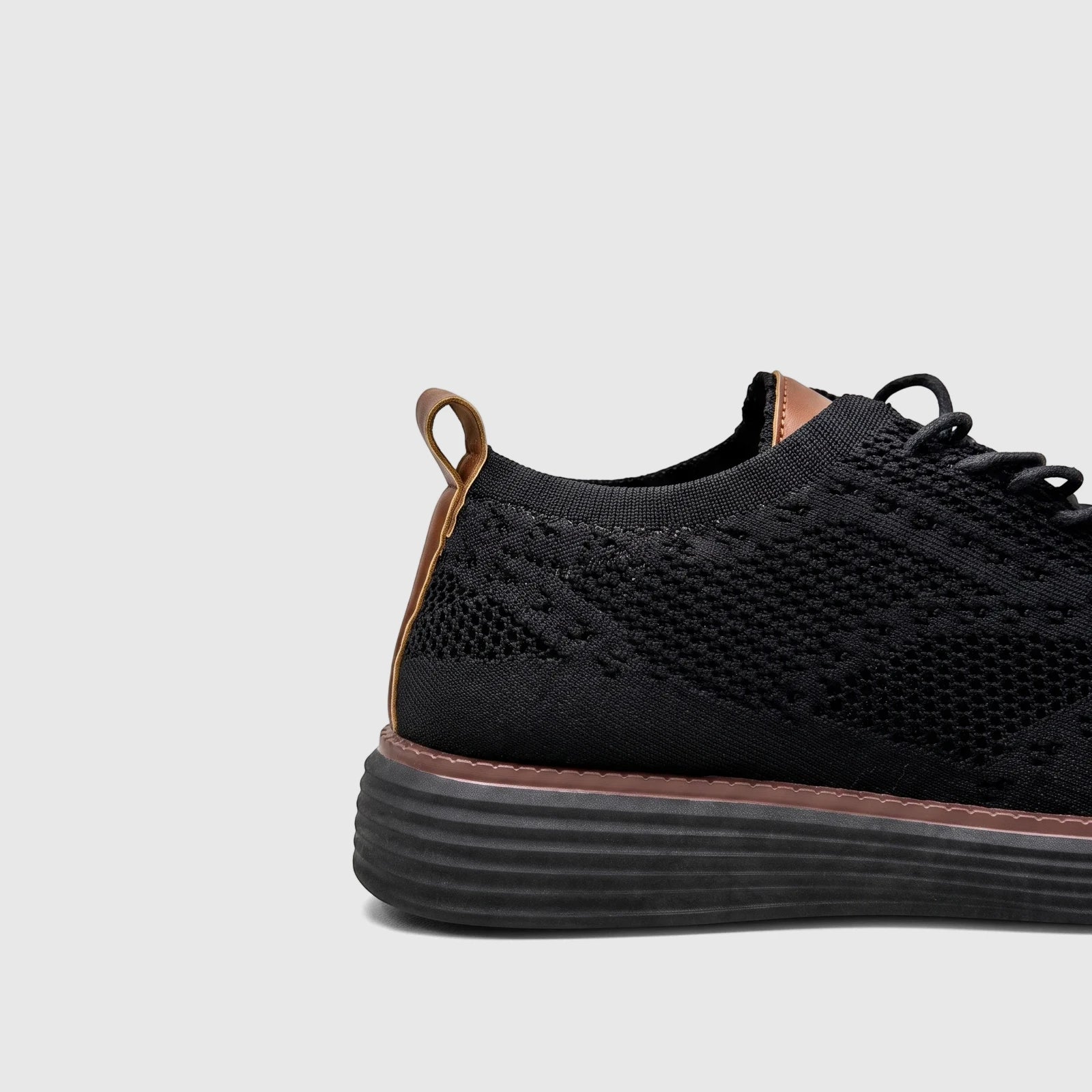 HP Men's Comfort Sneaker HPM01029 in black flyknit with brown accents, featuring a side and heel view.