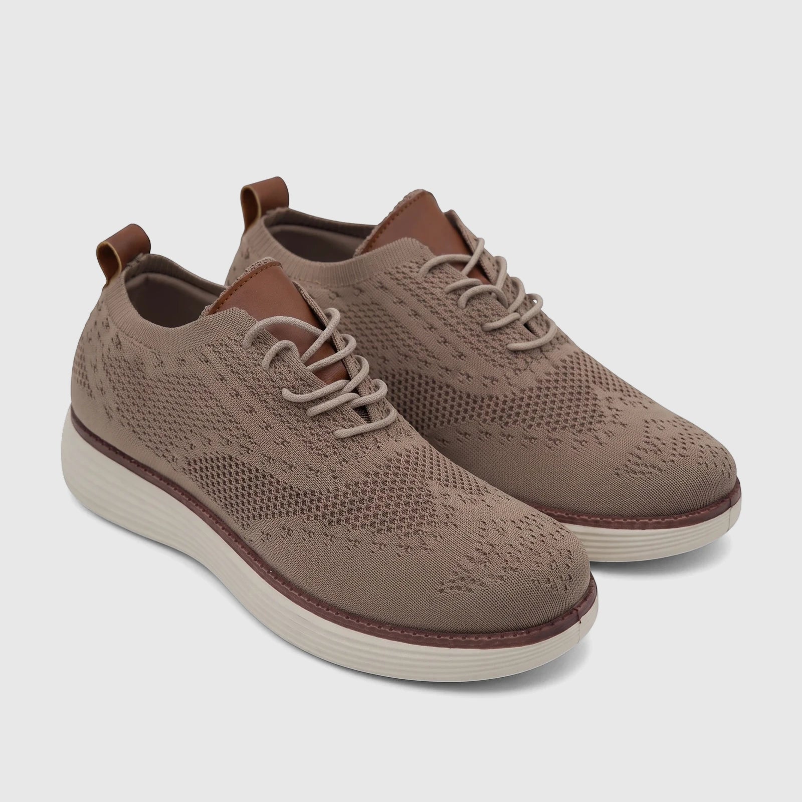 A pair of beige flyknit HP Men's Comfort Sneakers with brown accents, white soles, and light gray laces.