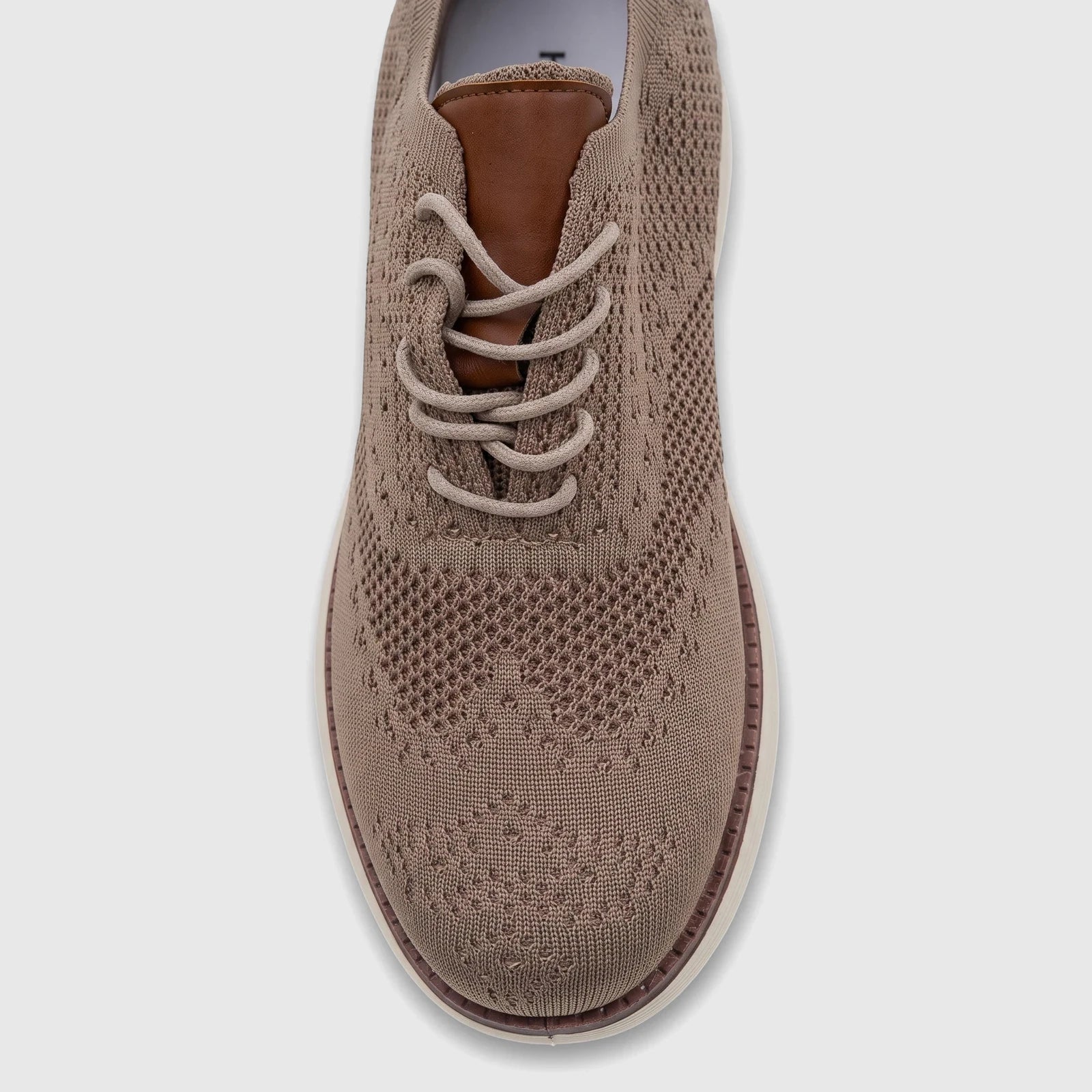 Top-down view of a single HP Men's Comfort Sneaker Styling HPM01029 in beige flyknit, featuring laces and a white sole.