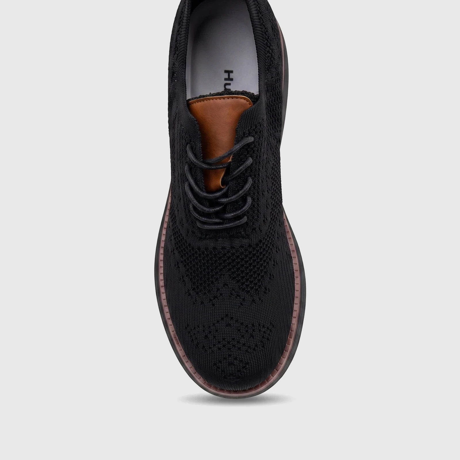 HP Men's Comfort Sneaker Styling HPM01029 black flyknit sneaker with brown trim and black laces, top-down view.