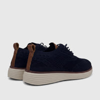 Pair of HP Men's Comfort Sneaker Styling HPM01029 shoes in navy blue flyknit with brown heel tabs and cream soles, viewed