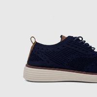 HP Men's Comfort Sneaker Styling HPM01029 navy flyknit sneaker, shown from a side view, featuring a ribbed sole.
