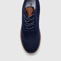 HP Men's Comfort Sneaker Styling HPM01029 navy knit sneaker, top-down view showing laces and brown tongue accent.