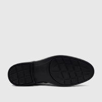 Black HP Men's Dress Lace Up Brogue Alaric shoe, featuring the detailed rubber sole with traction patterns and Hush Puppies