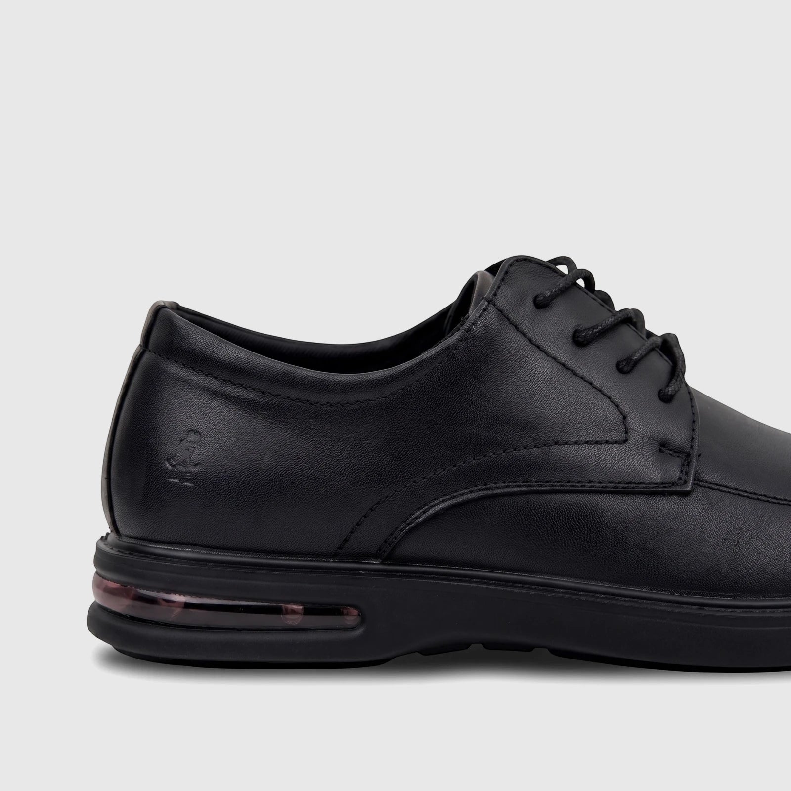 Black leather lace-up men's dress shoe from HP, featuring a subtle logo on the heel and an air pocket sole, viewed from the