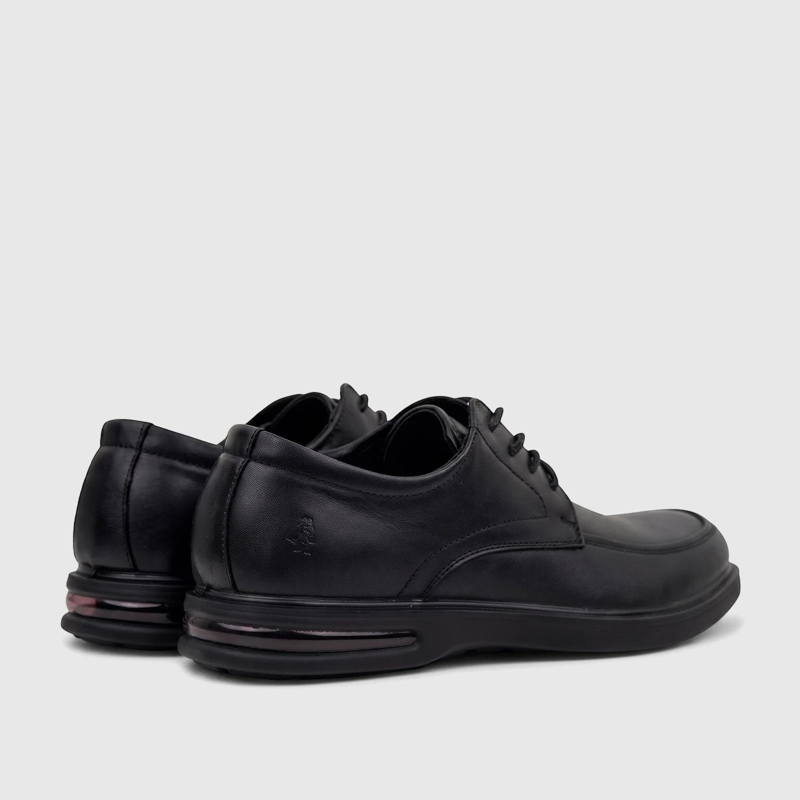 Black leather HP Men's Dress Lace Up Patrick shoes, viewed from a back-side angle, highlighting the design details and sole.