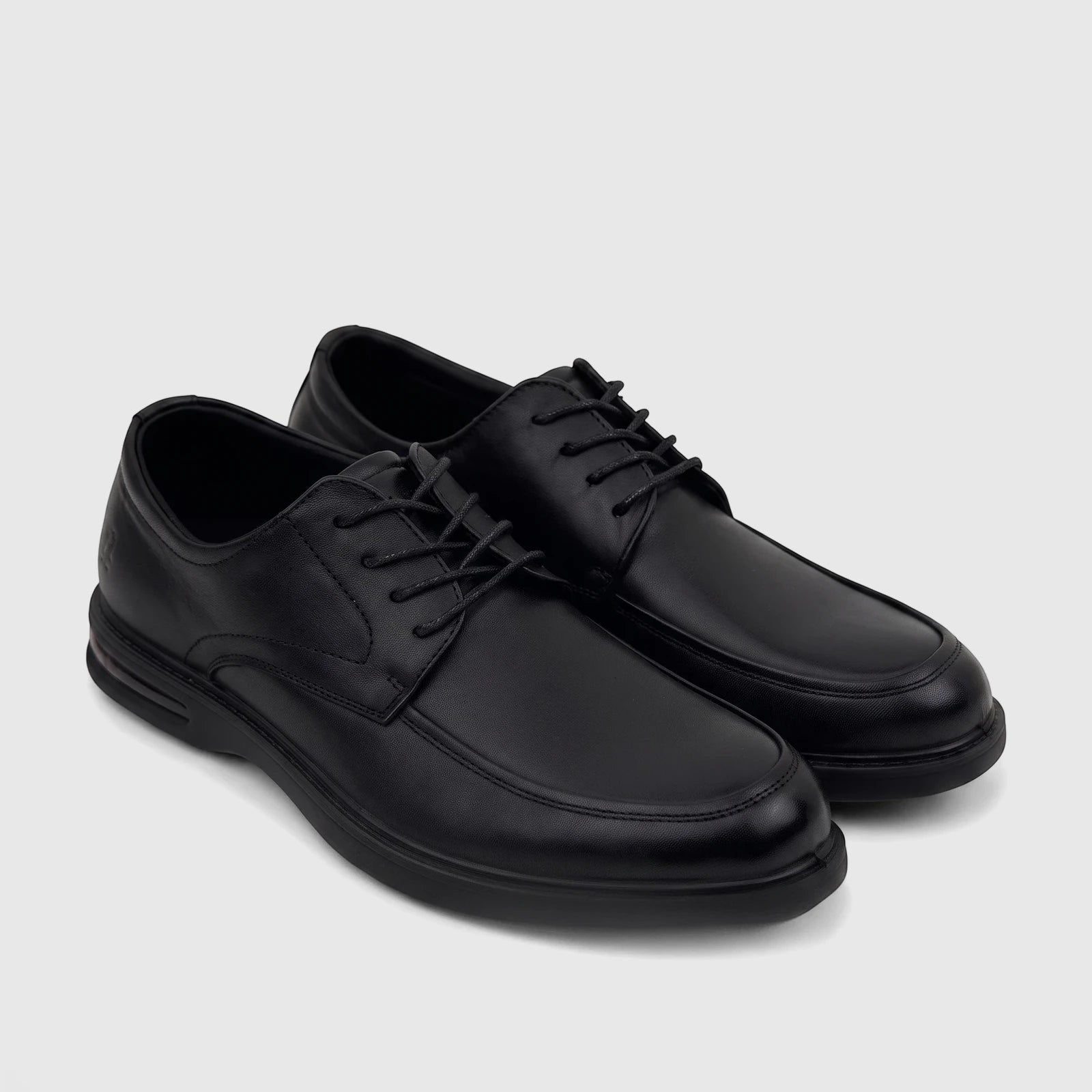 A pair of black leather HP Men's Dress Lace Up Patrick shoes with intricate stitching detail, seen from a high-angle view.