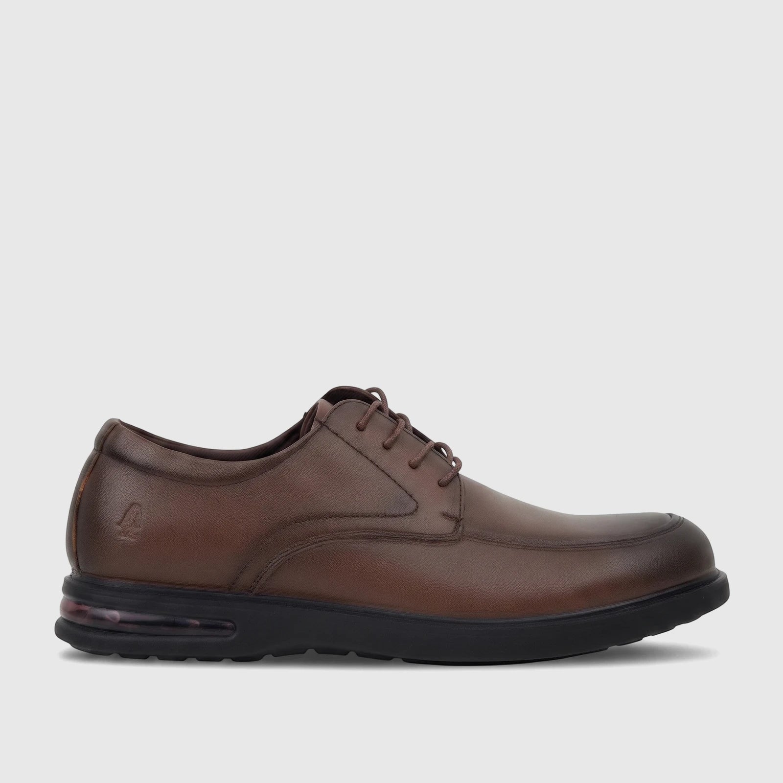 Brown leather men's lace-up dress shoe with a black sole and visible air cushion detail for comfort.