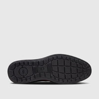 Bottom view of an HP Men's Dress Lace Up Patrick brown shoe, showing its black sole with grip pattern and Hush Puppies logo.