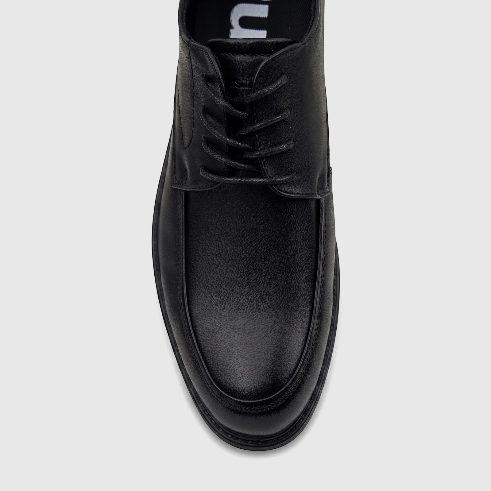 Black HP Men's Dress Lace Up Patrick shoe in smooth leather, featuring a classic design with laces and visible stitching,