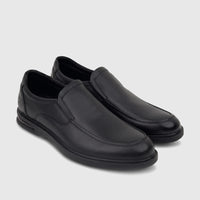 A pair of sleek black leather HP Men's Dress Slip On Julian shoes, featuring detailed stitching and a comfortable design,