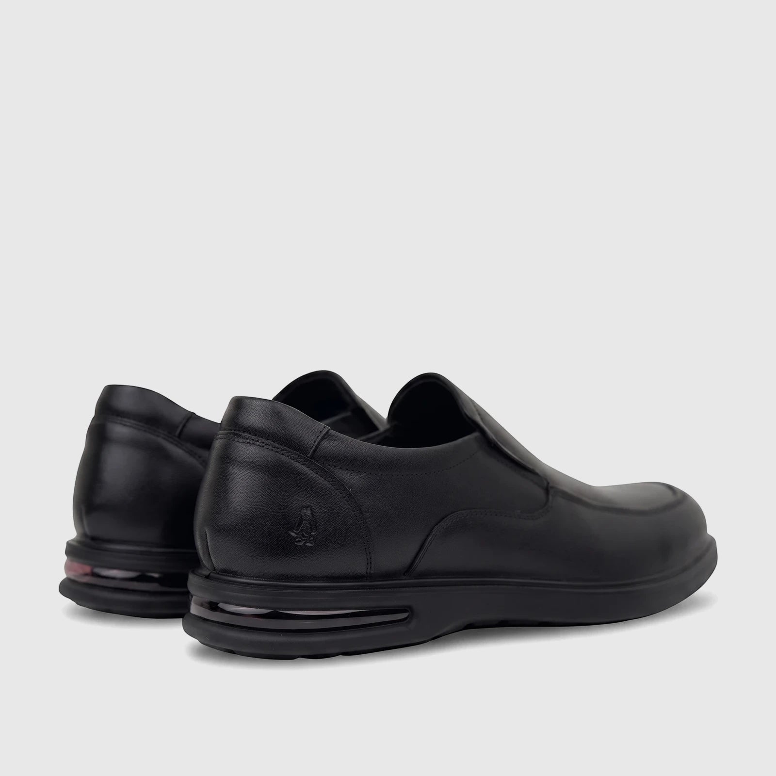 Black HP Men's Dress Slip On Julian HPM01022 shoes, showcasing their leather texture and distinctive sole details from a