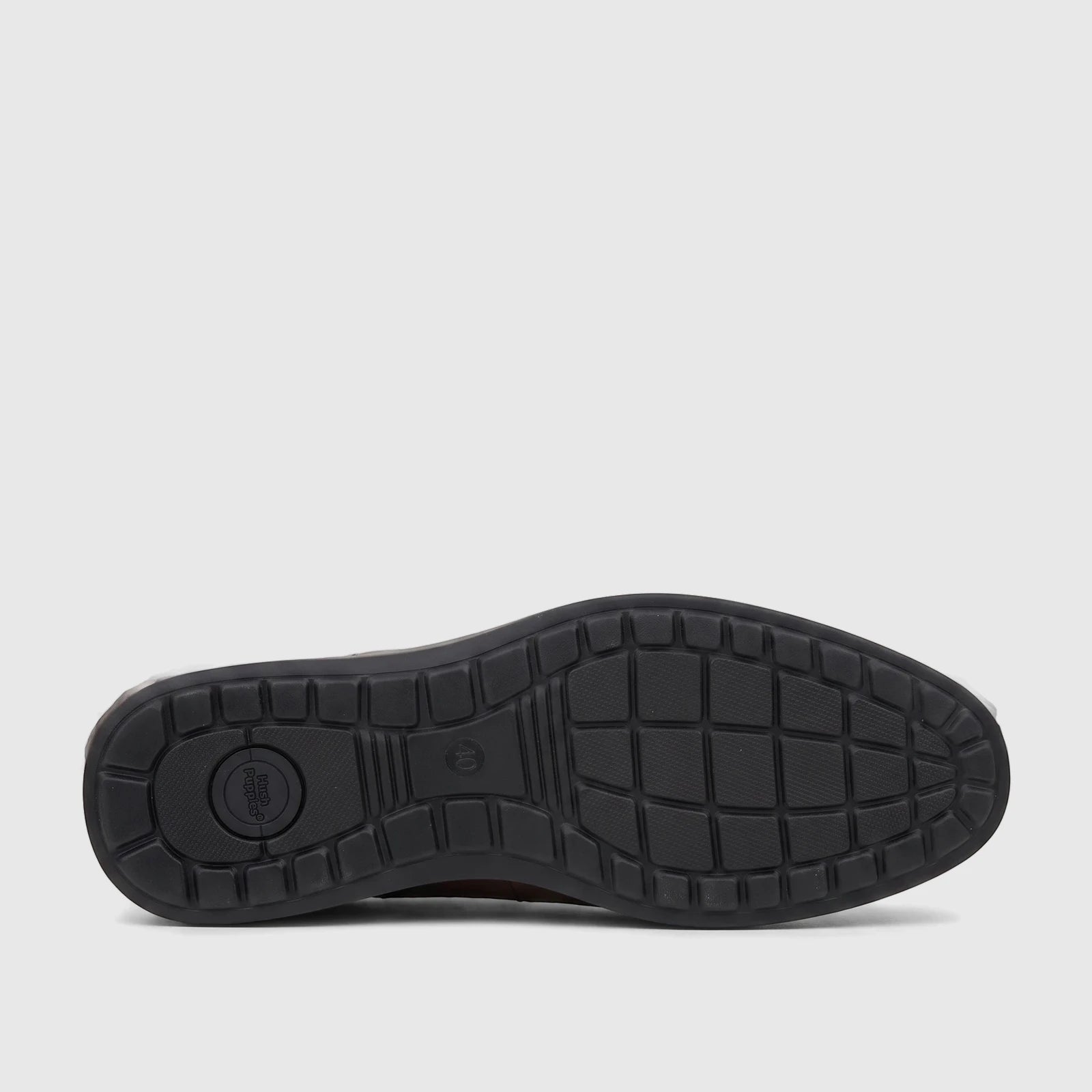 HP Men's Dress Slip On Julian shoe in brown, showcasing its black rubber sole with detailed tread pattern and brand logo.
