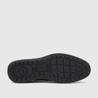 HP Men's Dress Slip On Julian shoe in brown, showcasing its black rubber sole with detailed tread pattern and brand logo.
