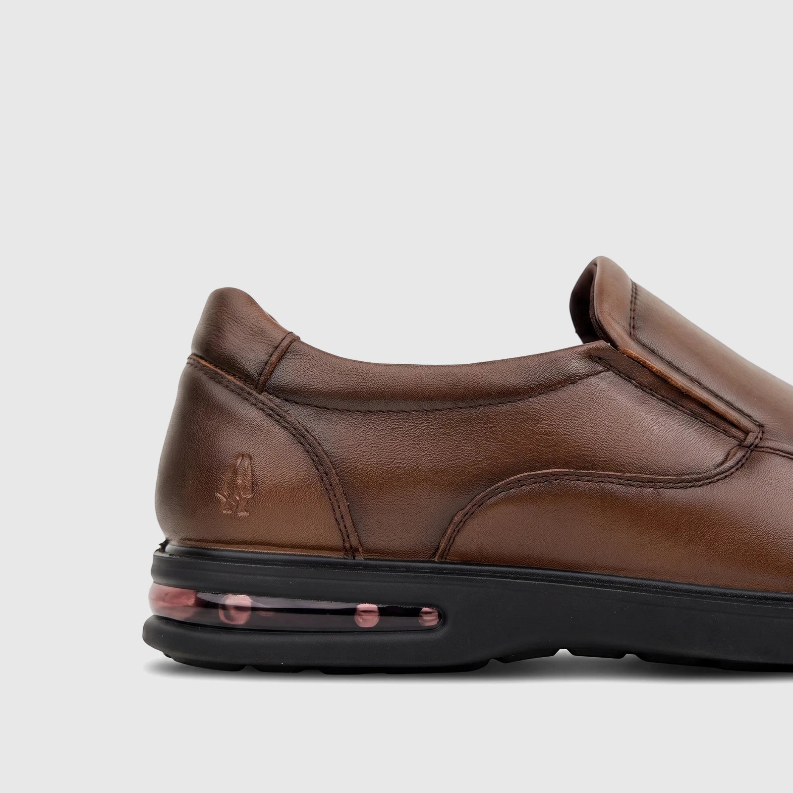 Men's HP Julian brown leather dress slip-on shoe with a black sole and visible air cushion unit for comfort.