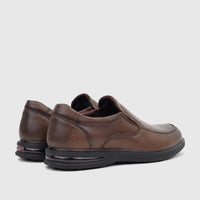 Brown leather HP Men's Dress Slip On Julian shoes, viewed from a slightly elevated rear-side perspective showing the slip-on