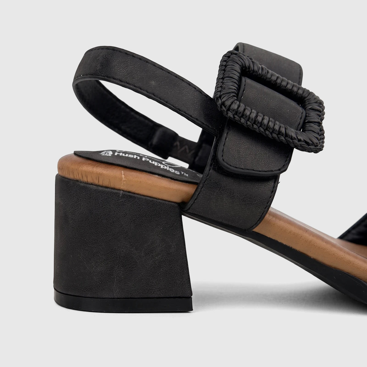 HP Soft Style Hetty Black block heel comfort sandal, shown in a side view revealing the textured buckle, ankle strap, and