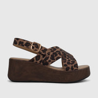 Ladies' HP Soft Style Jemma Comfort Wedge Sandal with leopard print upper and dark wood-look platform, side view.