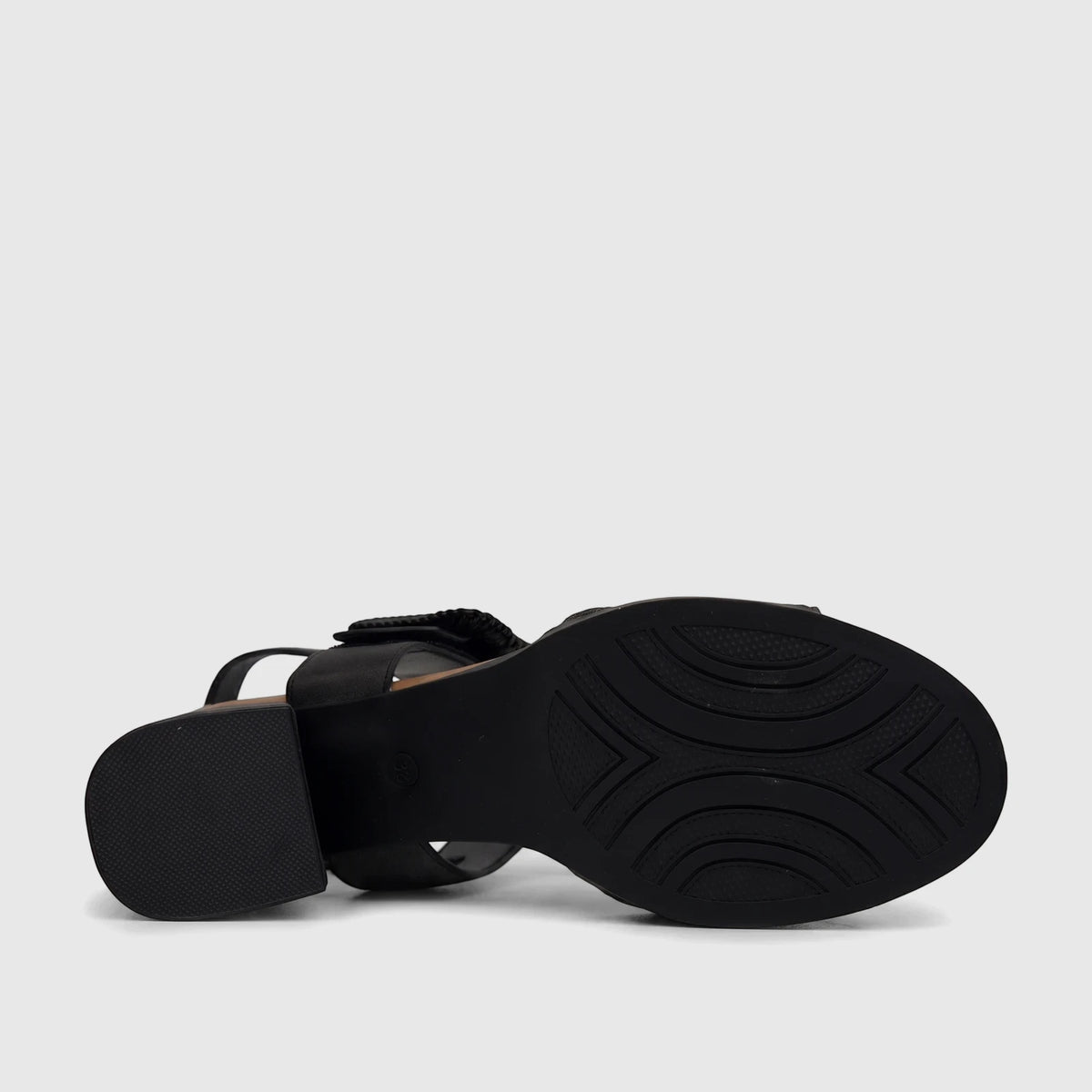 Bottom view of an HP Soft Style Ladies Comfort Block Heel Sandal in black, showing its textured sole, block heel, and
