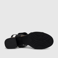 Bottom view of an HP Soft Style Ladies Comfort Block Heel Sandal in black, showing its textured sole, block heel, and