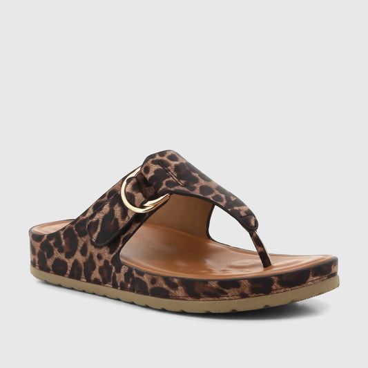Leopard print ladies comfort sandal with a gold-tone O-ring buckle, featuring a brown insole and tan sole, shown from a side