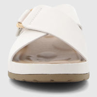 HP Soft Style Tanika white comfort sandals for ladies, featuring wide cross-straps and a visible golden buckle, shown from a