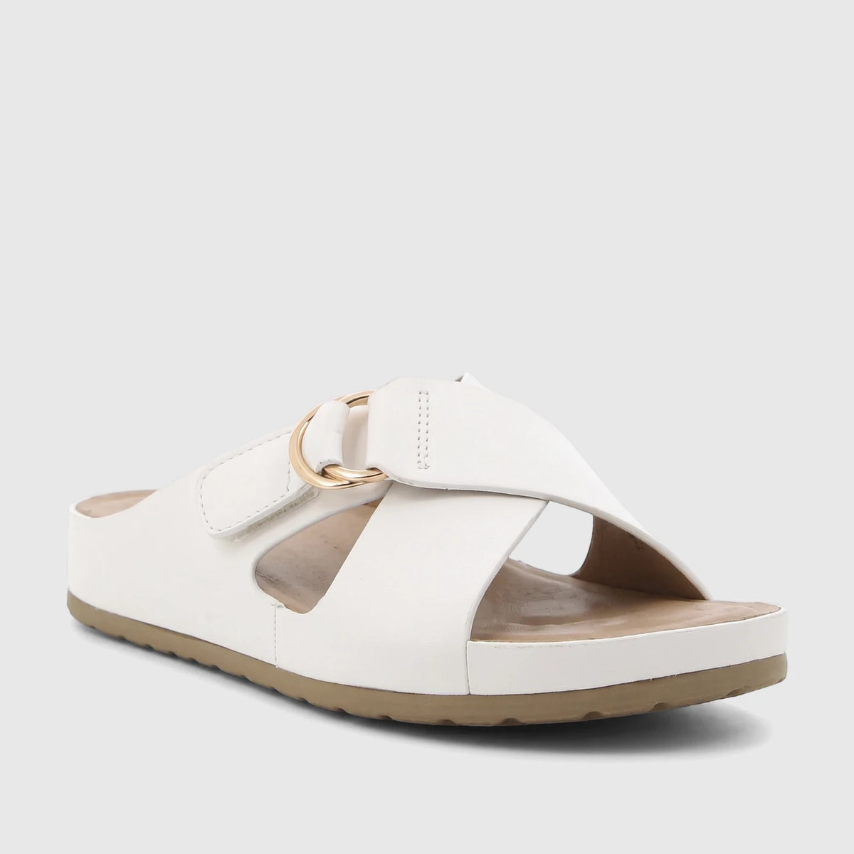 A single white HP Soft Style Tanika comfort slide sandal, featuring crossed straps with a gold-tone buckle and a tan sole.