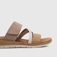 A side view of the Hush Puppies Soft Style Ladies Comfort Sandal Carmen SSL01655 featuring beige and brown straps with a