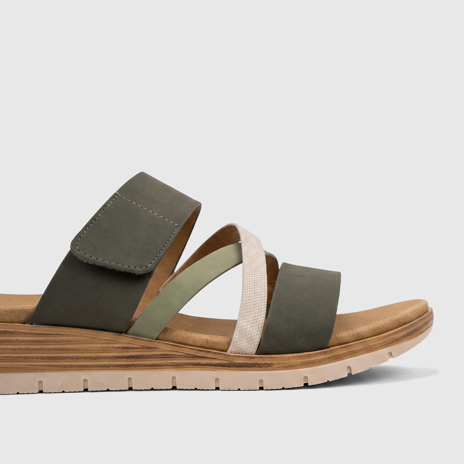 Hush Puppies Soft Style Ladies Comfort Sandal Carmen with khaki multi-color straps and a comfortable wedge sole.