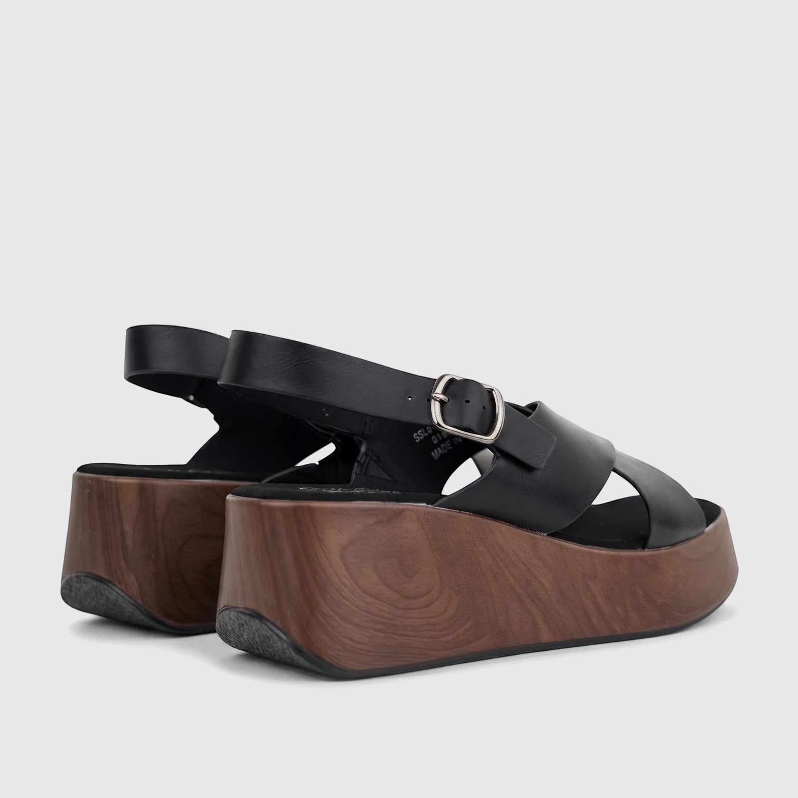 Black Hush Puppies Soft Style Jemma comfort wedge sandals featuring black leather straps and a wood-look platform.