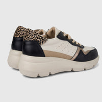 Hush Puppies Soft Style Jolanda ladies comfort sneaker in black multi leather with animal print heel, side view