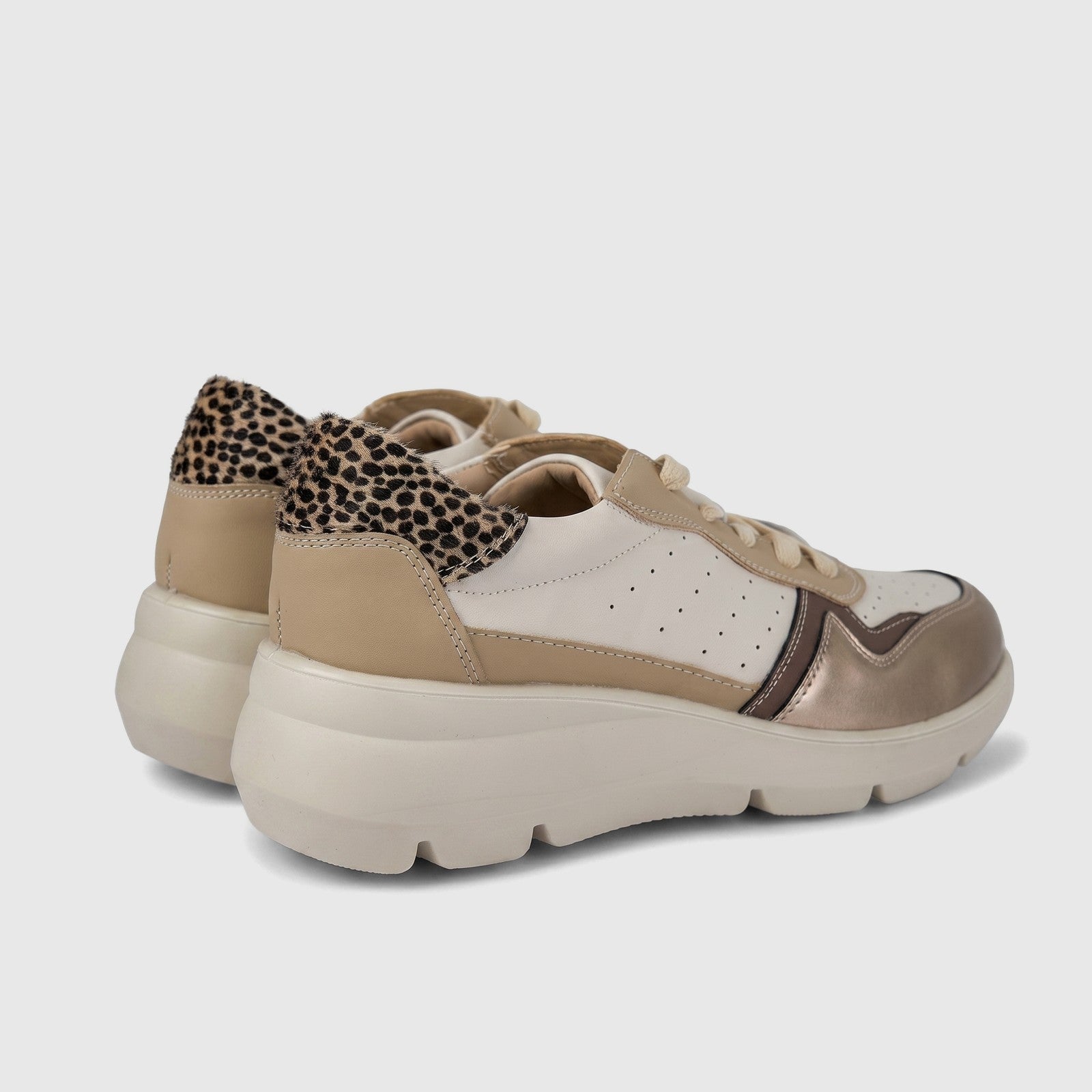 Hush Puppies Soft Style Jolanda ladies comfort sneaker in beige and white with leopard print heel, side view.