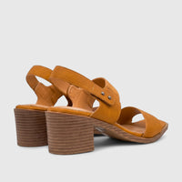 A pair of Hush Puppies Soft Style Ladies Block Heel Sandals in burnt orange, captured from a rear side angle.