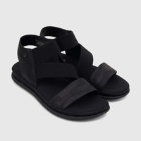 Pair of Hush Puppies Soft Style Ladies Comfort Sandals in black, featuring woven elastic straps and a flat sole.