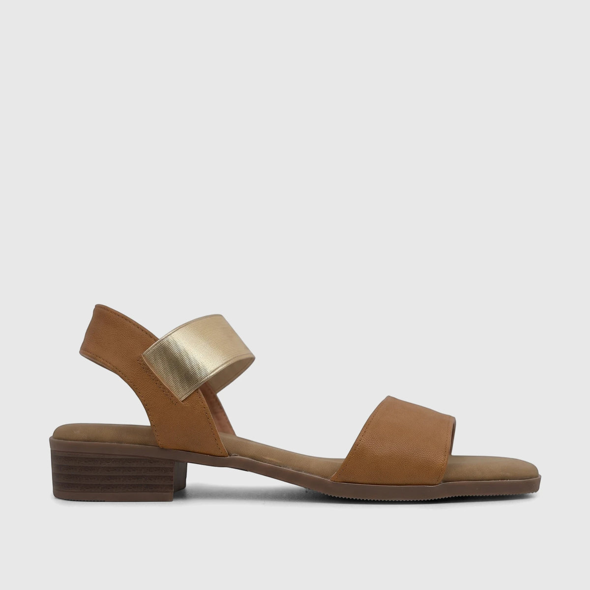 Hush Puppies Soft Style Ladies Comfort Sandal in Harlan Tan with a gold elastic strap and block heel, side view.
