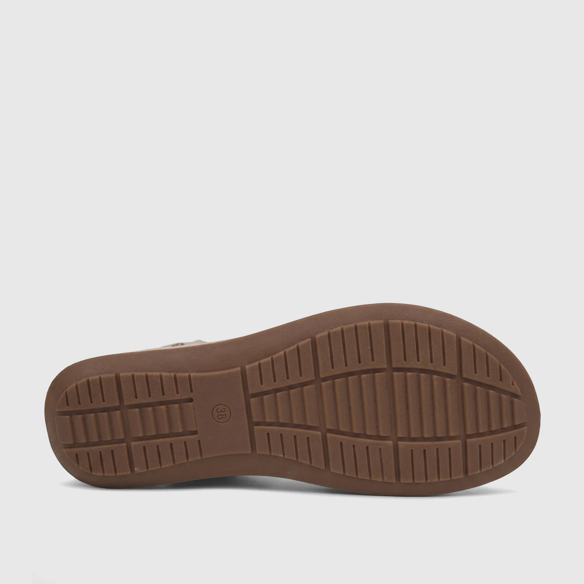 Brown sole of a Hush Puppies Soft Style Ladies Comfort Sandal Indy SSL01657 in Light Gold, featuring a ridged traction