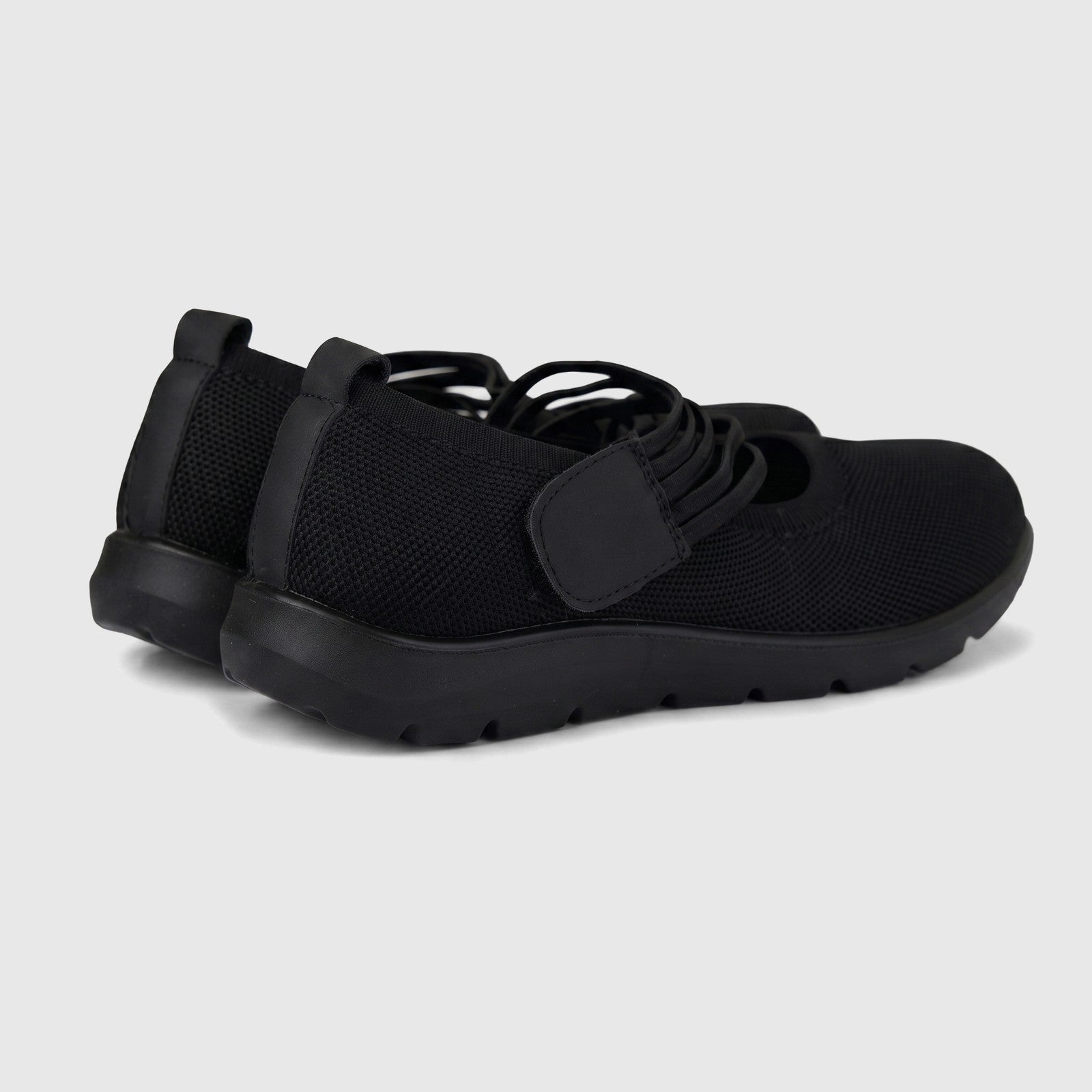 Hush Puppies Soft Style Soft Bartan ladies comfort pump in black with knit upper and thick cushioned sole, side view.