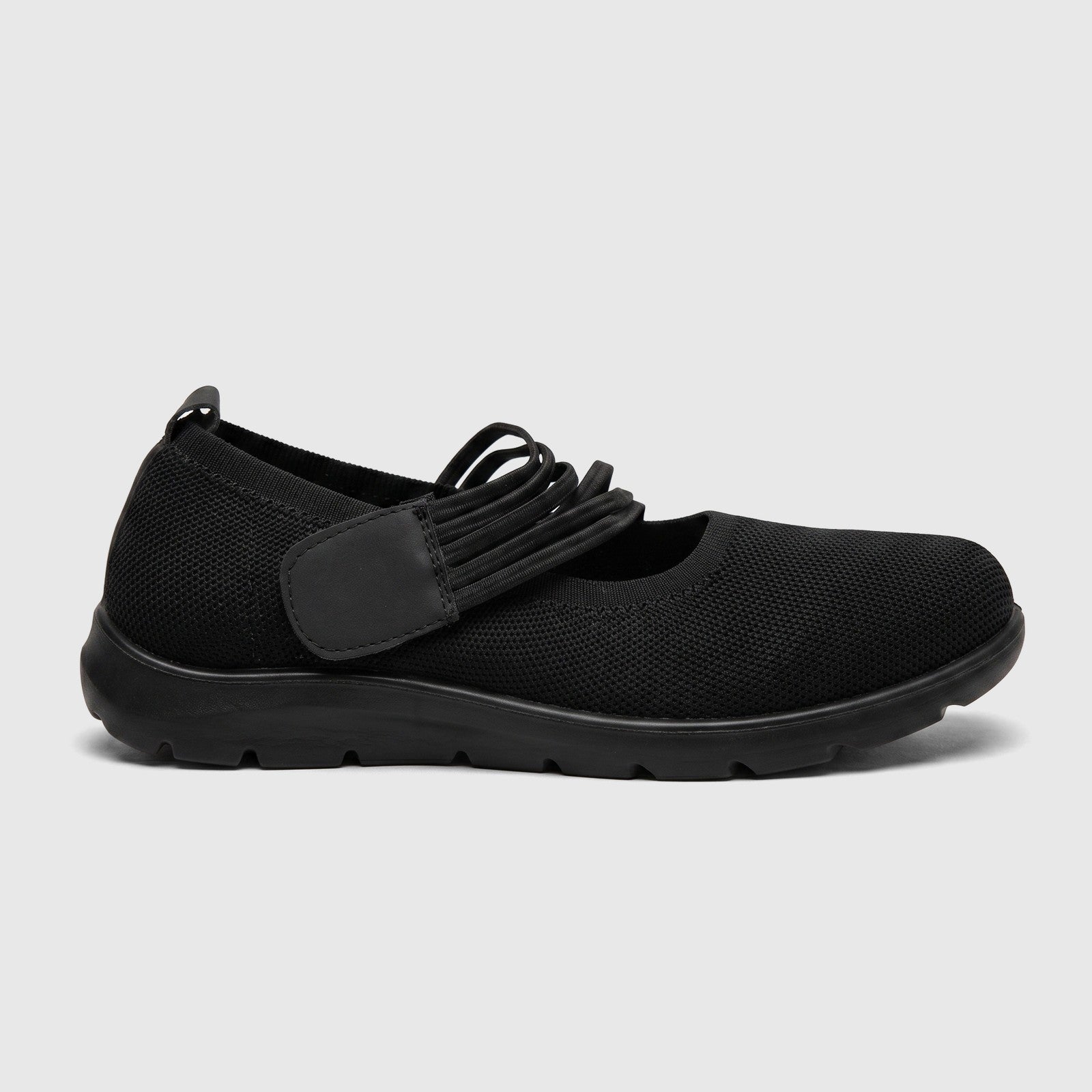 Hush Puppies Soft Style Soft Bartan ladies comfort pump in black, mesh slip-on shoe with elastic strap, side view.