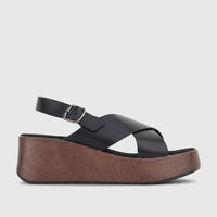Hush Puppies Soft Style Ladies Comfort Wedge Jemma sandal in black with criss-cross straps and a brown wood-look platform