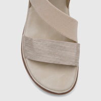 Light gold Hush Puppies Soft Style Indy comfort sandal for ladies, featuring textured criss-cross and ribbed straps.