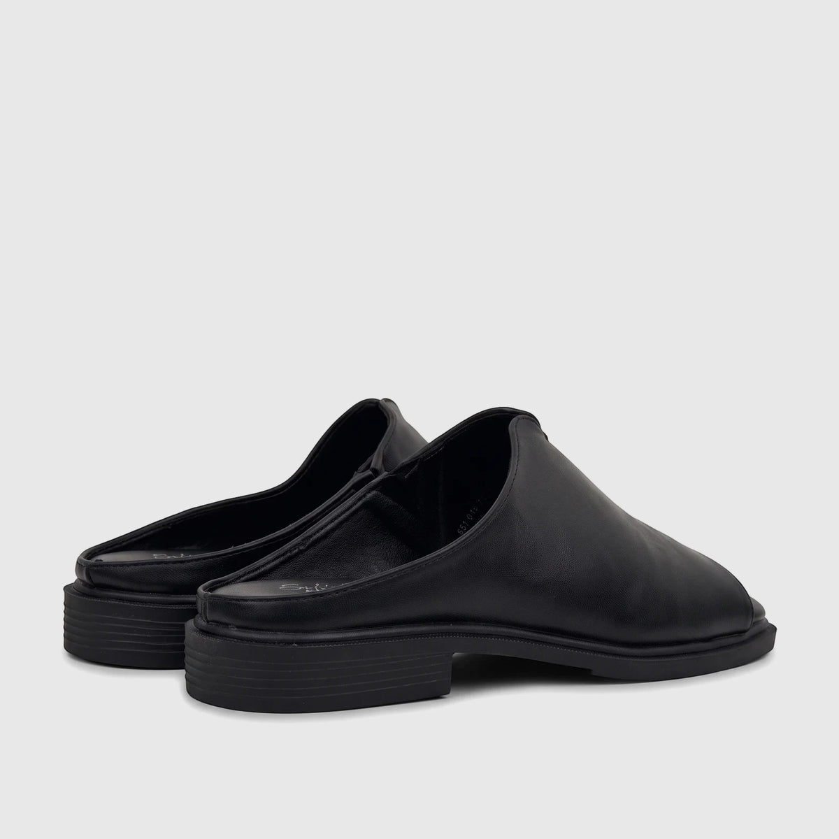 Black Hush Puppies Soft Style ladies comfort sandals, peep-toe mules with a low block heel, seen from a side perspective.