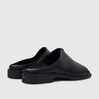 Black Hush Puppies Soft Style ladies comfort sandals, peep-toe mules with a low block heel, seen from a side perspective.