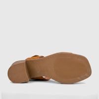 Hush Puppies Soft Style Ladies Block Heel Sandal Abrianna in burnt orange, viewed from the sole up, showcasing the textured