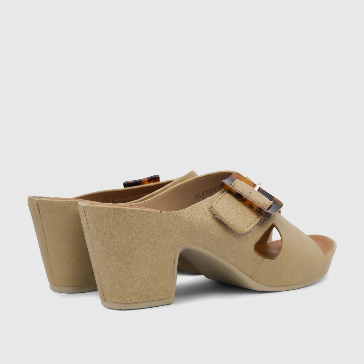 A pair of Hush Puppies Soft Style Ladies Block Heel Sandals, Cadena SSL01683 in fawn, featuring a tortoiseshell buckle. Side