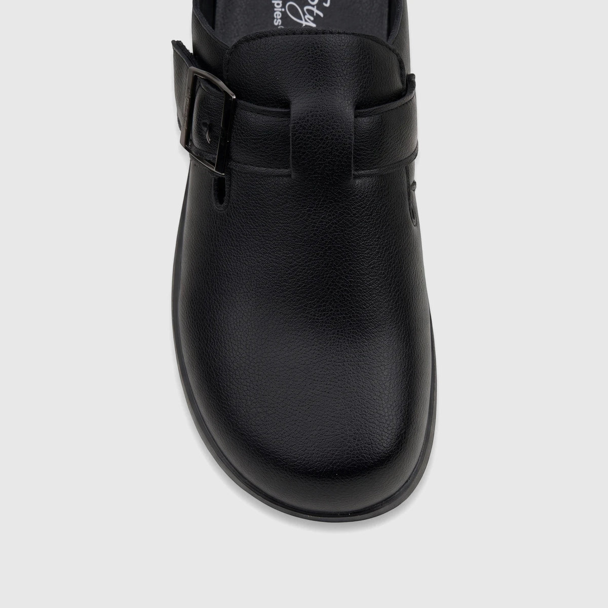 Close-up view of a black Hush Puppies Soft Style Ladies Comfort Clog, featuring textured faux leather and a buckle detail.