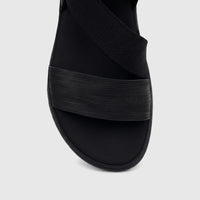 Close-up view from above of a Hush Puppies Soft Style Ladies Comfort Sandal Indy, featuring black elastic straps.
