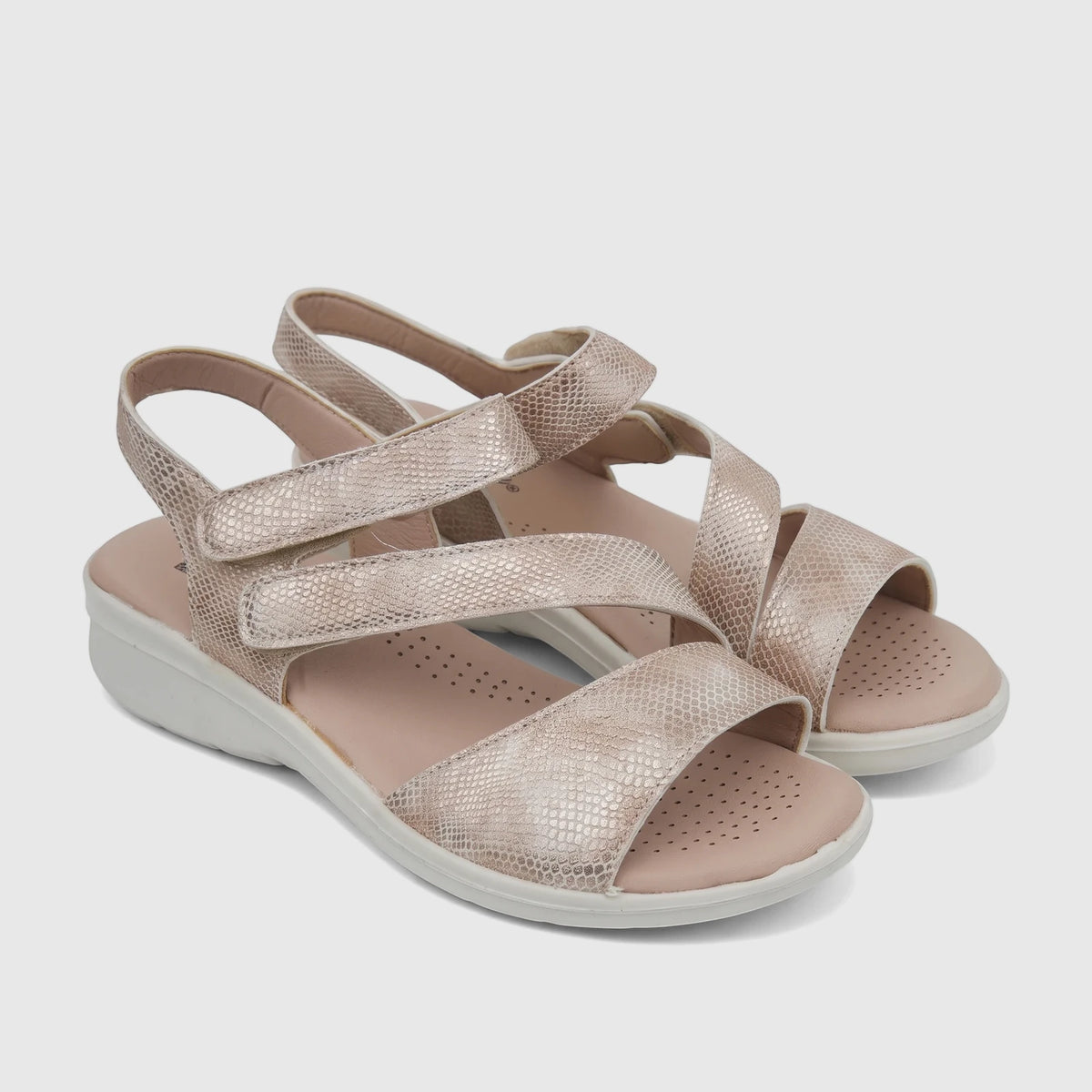 Hush Puppies Soft Style Ladies Comfort Sandal in light gold with a snakeskin texture and white soles.
