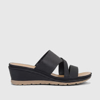 Hush Puppies Soft Style Ladies Comfort Sandal Posha in black, with textured criss-cross straps, a ribbed wedge heel, and a
