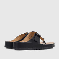 A pair of black Hush Puppies Soft Style Ladies Comfort Sandals, Tanya model, with a pebbled texture, viewed from the side.